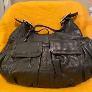 Like new, leather bag w/dark brown stitching, two front pockets, silver buckle.